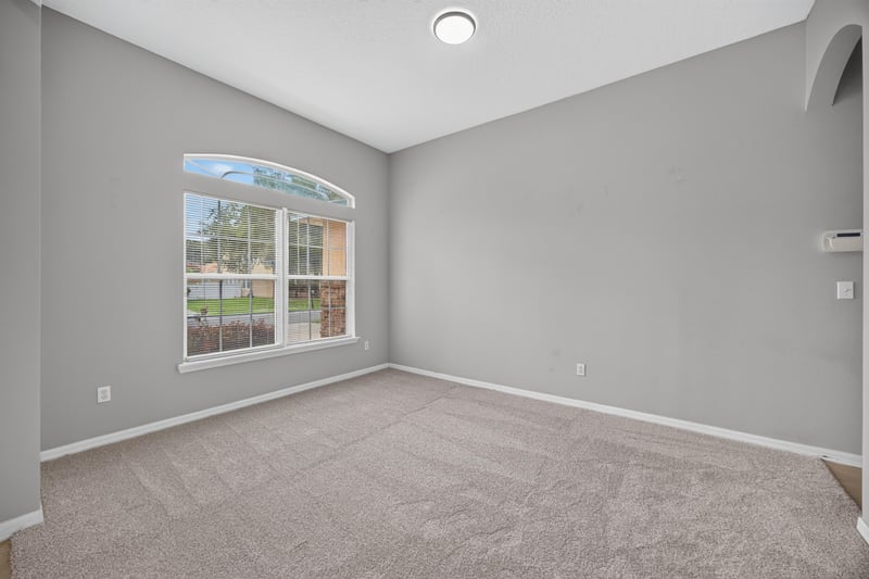 Bedroom with window and carpet at 635 Wakeview Dr, Orange Park, FL 32065