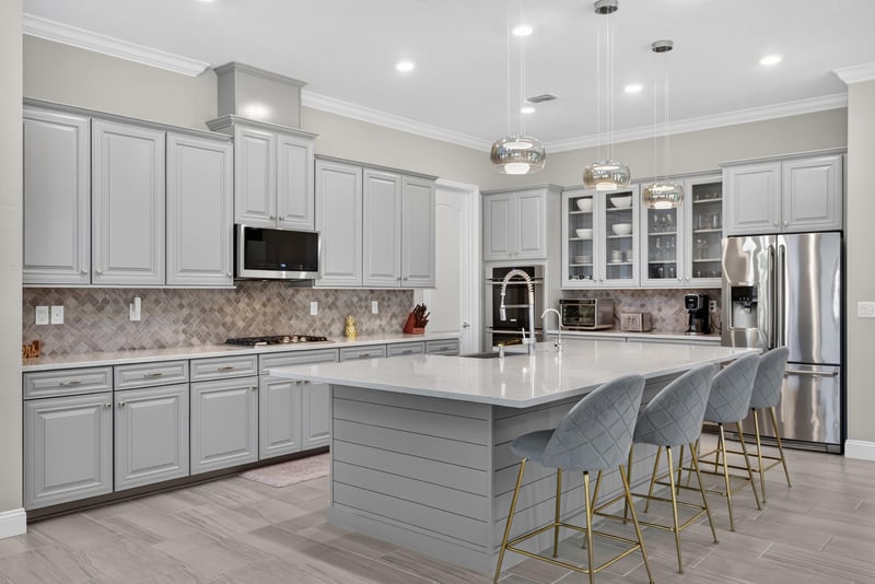 Kitchen with island and stainless appliances at 22 Azura Point