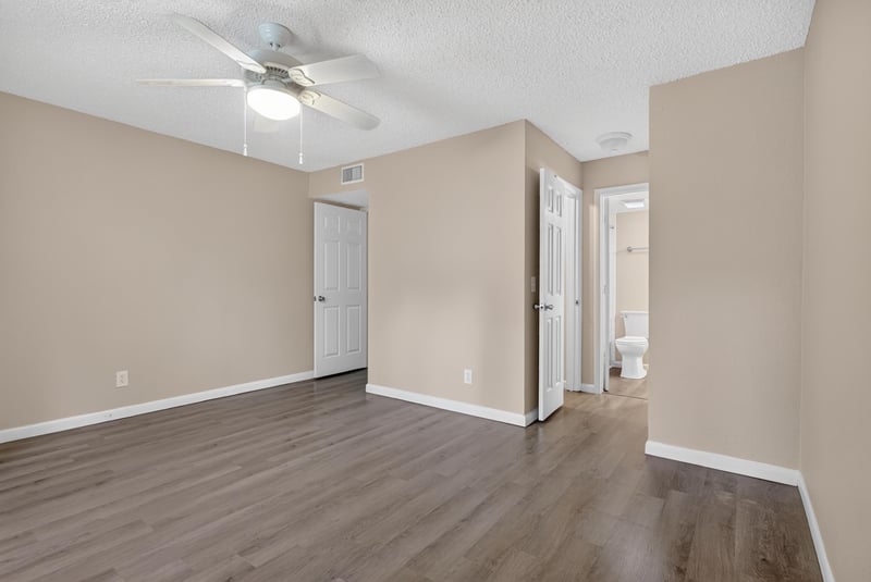 Empty bedroom with ceiling fan and doorway at 5811 Atlantic Blvd unit 47, Jacksonville, FL 32207
