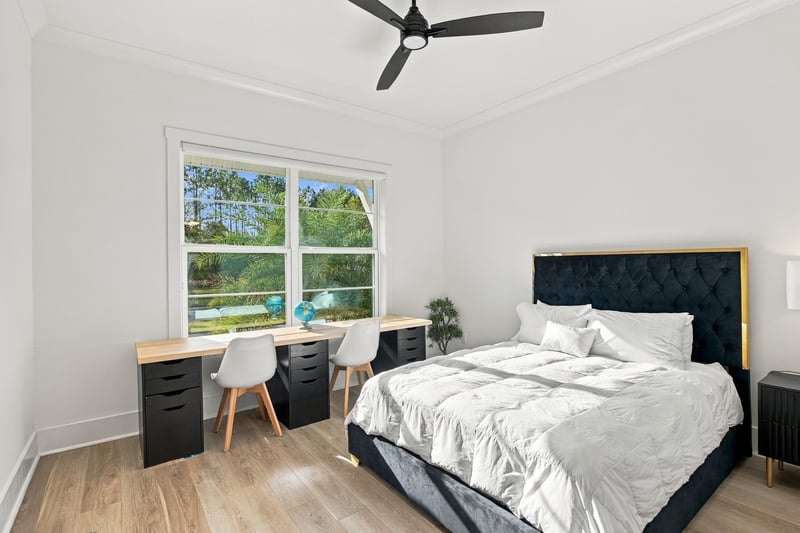 Bedroom with desk and upholstered headboard at 907 Seagrove Dr, Ponte Vedra Beach, FL 32081