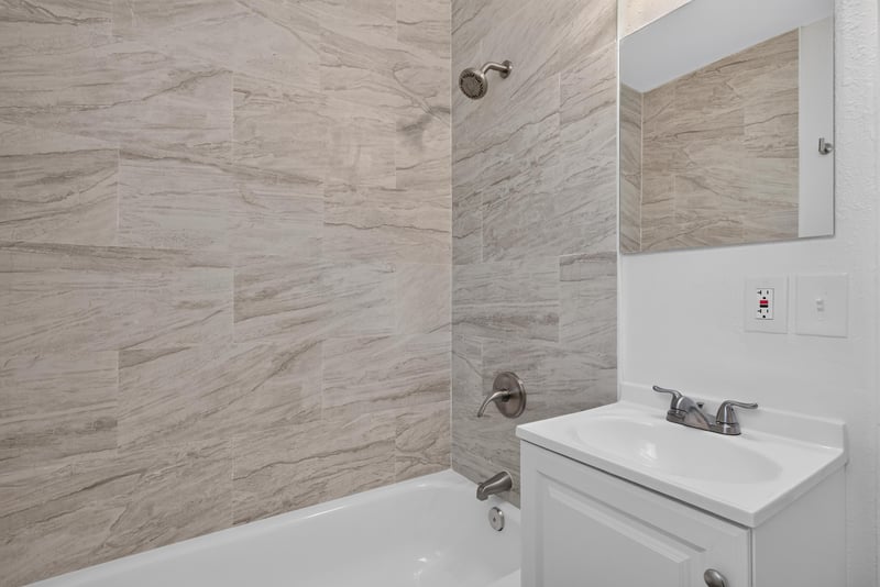 Bathroom with tiled tub-shower combo at 855 Cornwallis Dr, Jacksonville, FL