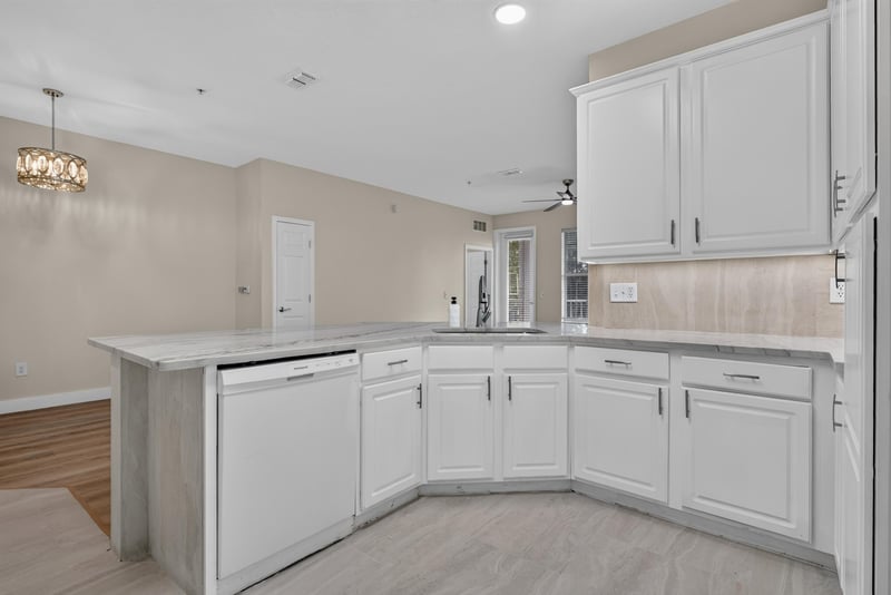 Kitchen corner with white cabinets and lighting at 11251 Campfield Dr unit 1202, Jacksonville, FL 32256