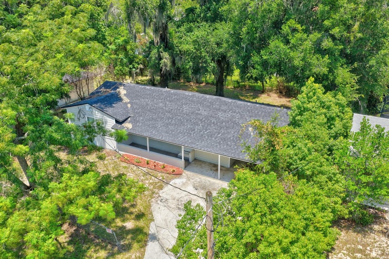 Drone view of roofline and driveway at 855 Cornwallis Dr, Jacksonville, FL