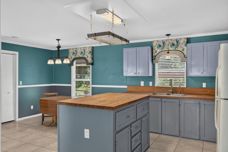 Kitchen island with butcher block counter at 2549 Snapdragon Ave, Middleburg, FL 32068