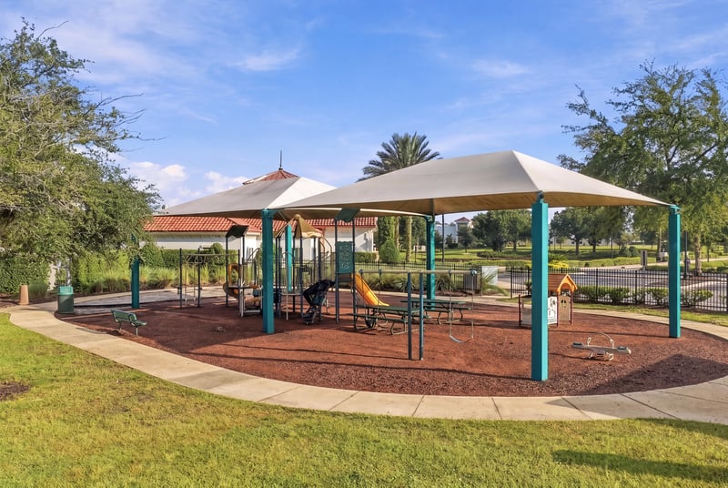 Community playground with shade structure in Murabella