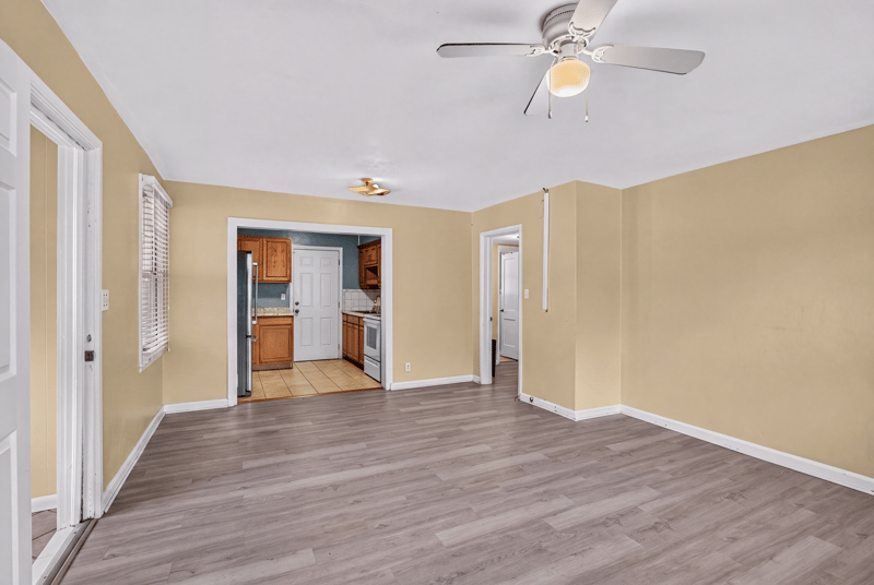 Open living and kitchen area with wood-look flooring at 2841 Ernest St, Jacksonville, FL 32205