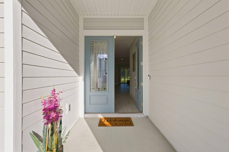 Entry hallway with glass front door and tile flooring at 27 Holly Rdg Wy, St. Augustine, FL