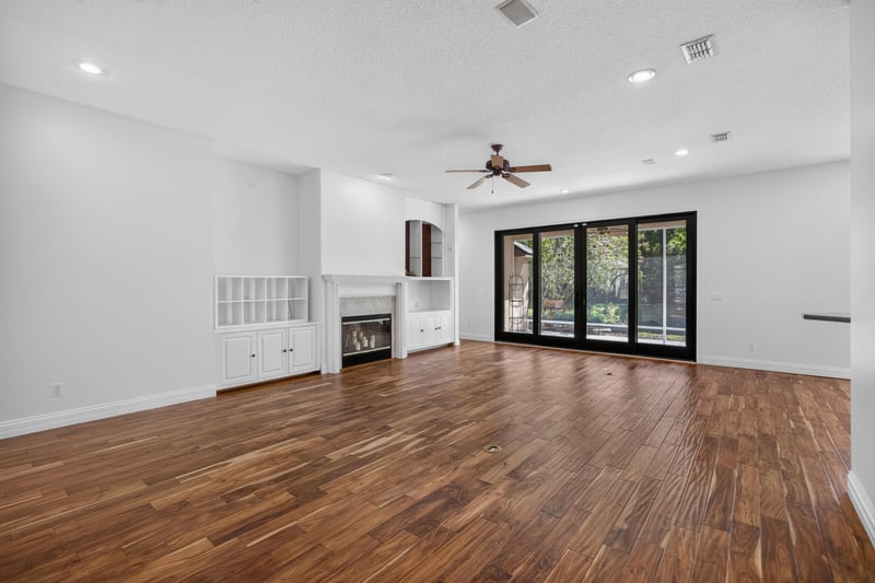 Living room with fireplace and built-in shelving at 11675 Magnolia Estates Rd, Jacksonville, FL 32223