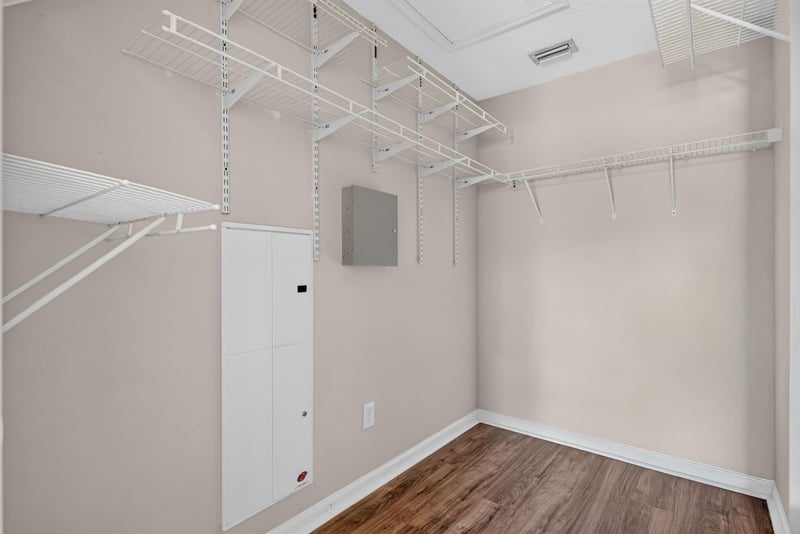 Walk-in closet with built-in shelving at 7047 Deer Lodge Cir, Jacksonville