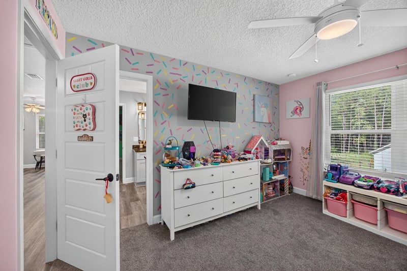 Bedroom with television and dresser at 2817 Camel Cir, Middleburg, FL