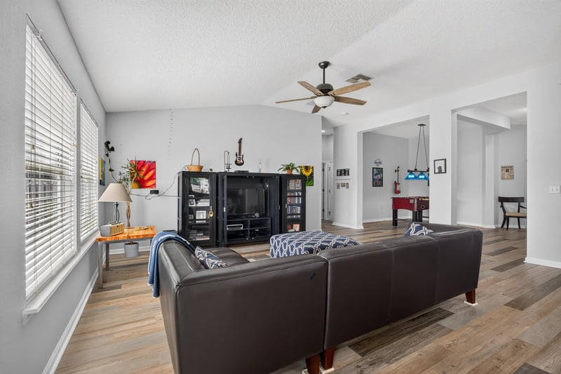 Living room with open layout and ceiling fan at 2065 Creekmont Dr