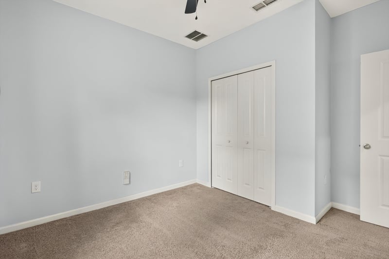 Carpeted room with closet door at 2378 Caney Oaks Dr, Jacksonville, FL