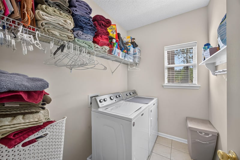 Laundry room with washer, dryer and shelving at 3660 Middlebrook Dr, Orange Park, FL 32065
