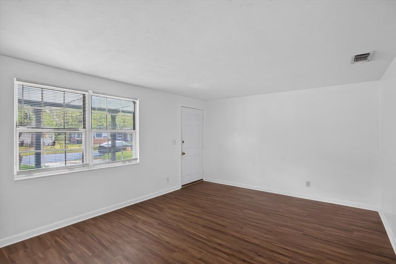 Empty room with window and side door at 5812 Tampico Rd, Jacksonville, FL 32244