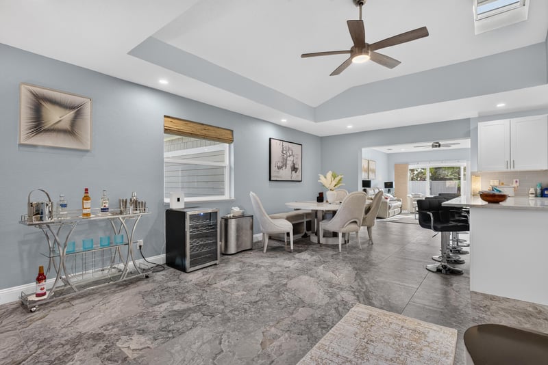 Open living, dining and kitchen area with tray ceiling at 1525 8th St N, Jacksonville Beach, FL