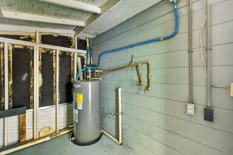 Utility area with water heater near screened porch at 6745 Jack Horner Ln, Jacksonville, FL 32210