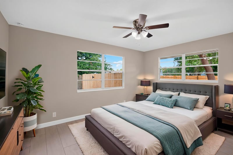 Bedroom with virtually staged bed and window view at 4117 Wilcrest Ct, Jacksonville, FL 32277