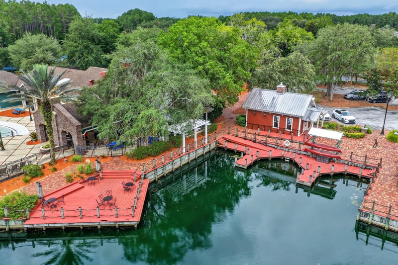 Aerial view of lakeside dock and pavilion in Oakleaf Plantation