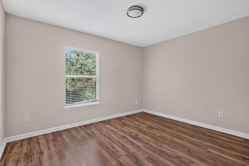 Corner bedroom with two windows at 7047 Deer Lodge Cir, Jacksonville