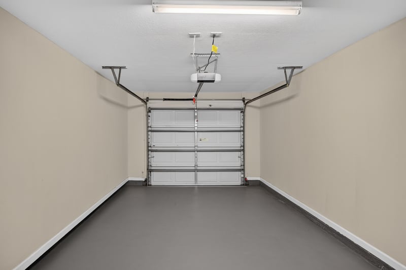 Garage interior with overhead door at 10075 Gate Pkwy unit 1905, Jacksonville, FL 32246