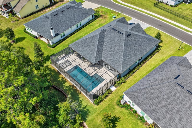 Aerial view of the home and nearby streets in Whisper Creek