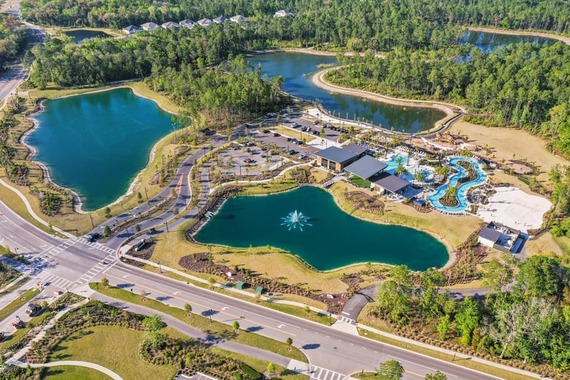 Aerial view of community pool and pond in St. Johns, FL