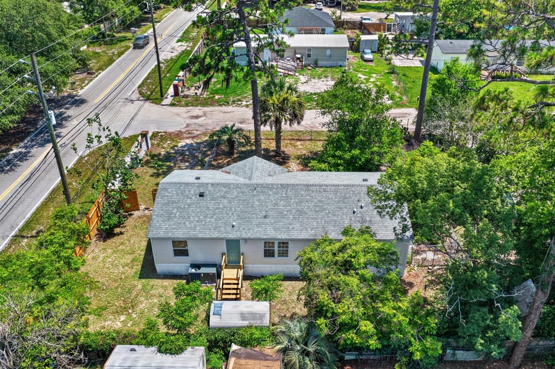 Aerial view of home along street at 7603 Coach Park Dr, Jacksonville, FL 32244