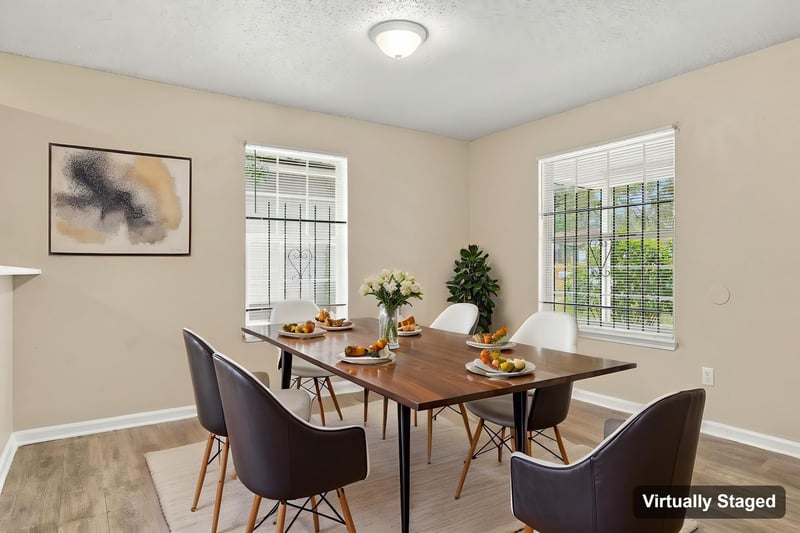 Dining area with table and chairs, virtually staged, at 219 Shortreed St, Jacksonville, FL 32254