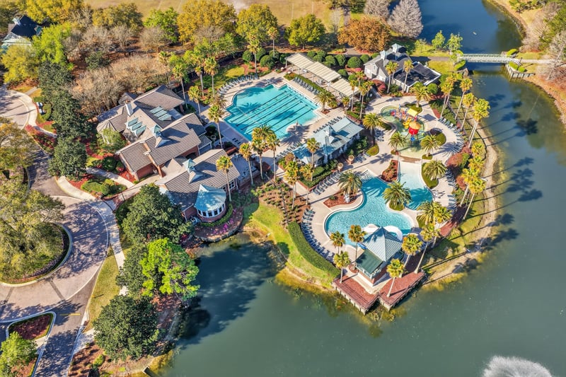 Aerial view of pool complex along the lake in Oakleaf Plantation