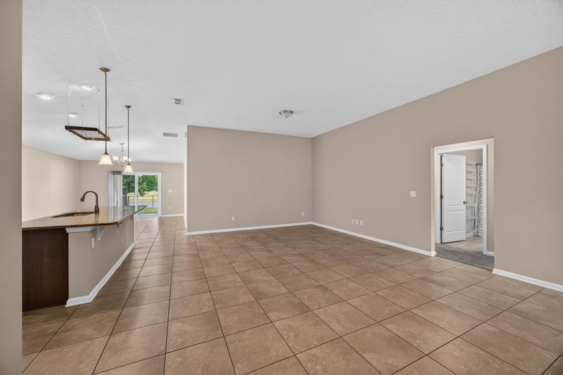 Living room with tile floor and pendant light at 469 Glendale Ln, Orange Park, FL