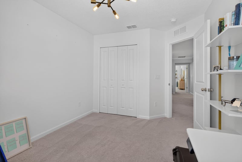 Empty secondary bedroom with closet at 1186 Beach Dune Dr, Jacksonville, FL 32233