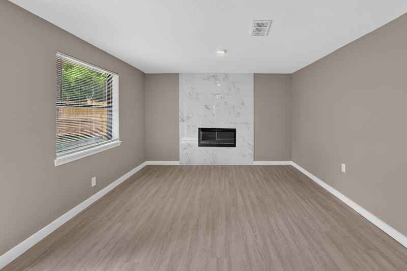 Empty room with marble-tile fireplace at 184 Draco St, Orange Park, FL 32073