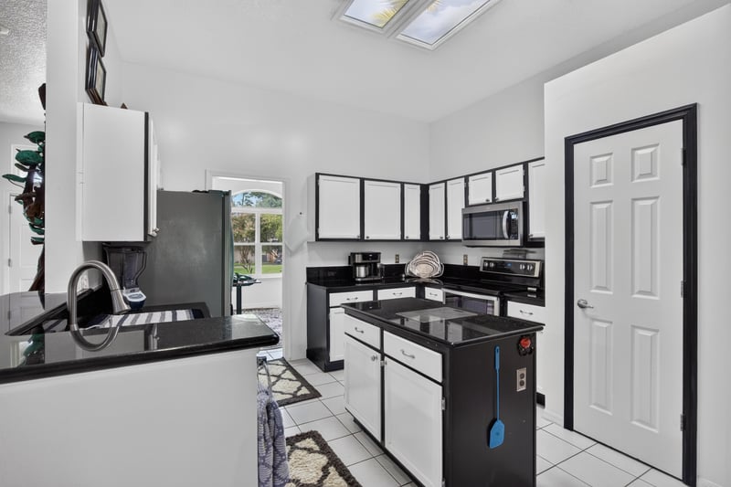 Kitchen counter and black appliances at 1346 Gately Ct, Jacksonville, FL 32225