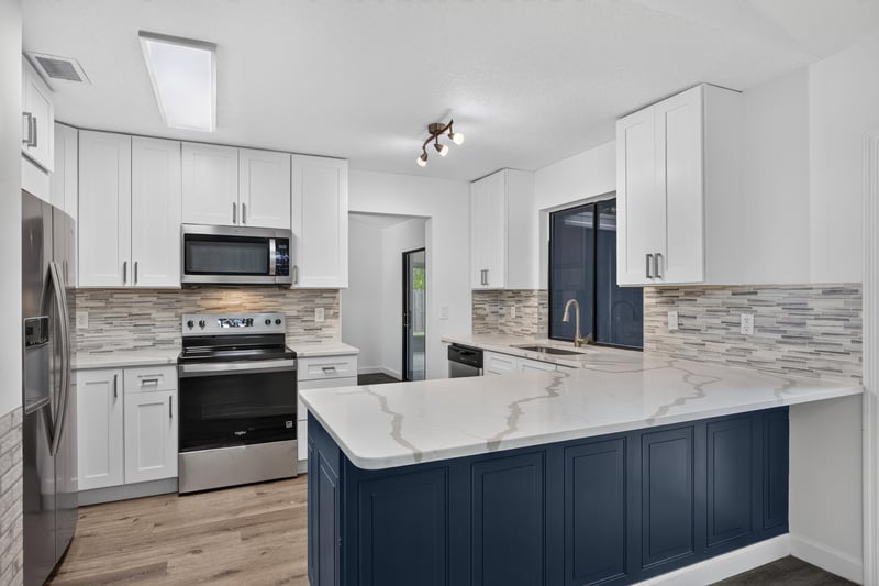Kitchen with blue island and stainless range at 551 Deltona Blvd, St. Augustine, FL 32086