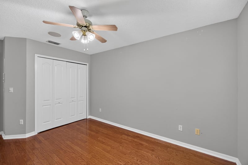 Bedroom with wood floor and closet at 635 Wakeview Dr, Orange Park, FL 32065