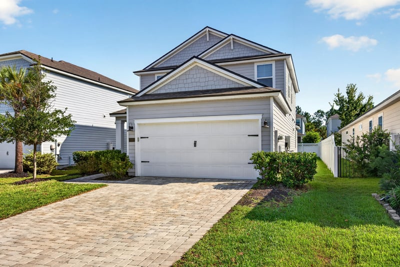 Front exterior with landscaped yard at 331 Millerstone Dr, St. Augustine, FL 32092