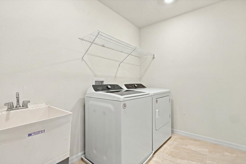 Laundry room with washer and dryer, photographed by Megapixeler on Torres Trace, St. Augustine