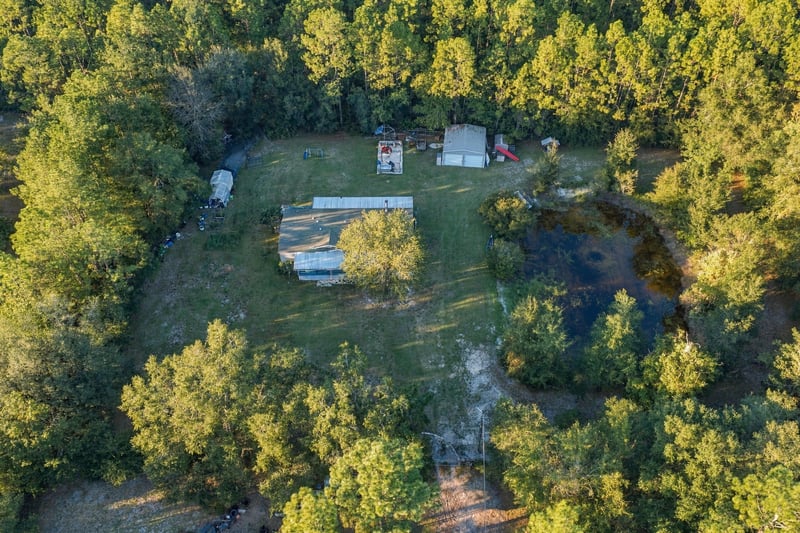 Aerial view of property and pond, photographed by Megapixeler on Secret Cove Rd, Middleburg, FL