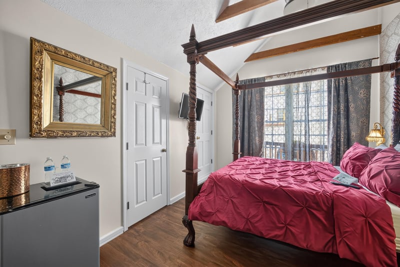 Bedroom corner with a mirror and mini fridge at 115 Cordova St, St. Augustine, FL