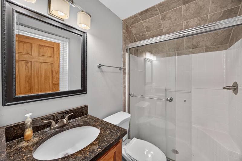 Bathroom vanity with glass shower at 1735 Hagans Ridge Ct