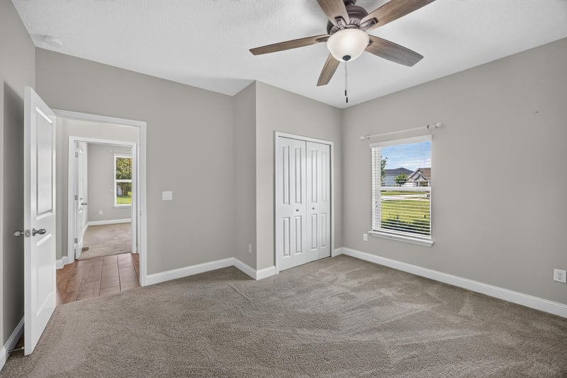 Hallway with closet doors and window at 53 Lumen Ct, St. Augustine, FL 32095