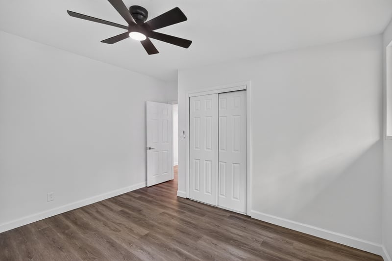Bedroom corner with double closet doors at 3113 Kline Rd, Jacksonville, FL 32246