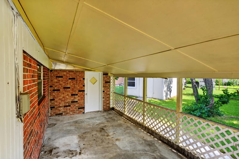 Covered brick breezeway with concrete floor at 5503 Boeing Dr, Jacksonville, FL 32207