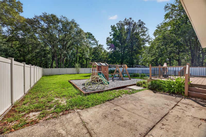 Backyard playground with privacy fence at 892 Branscomb Rd, Green Cove Springs, FL