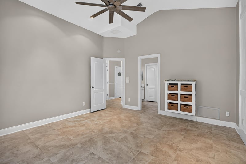 Empty room with tray ceiling at 117 Island Cottage Way, St. Augustine, FL 32080