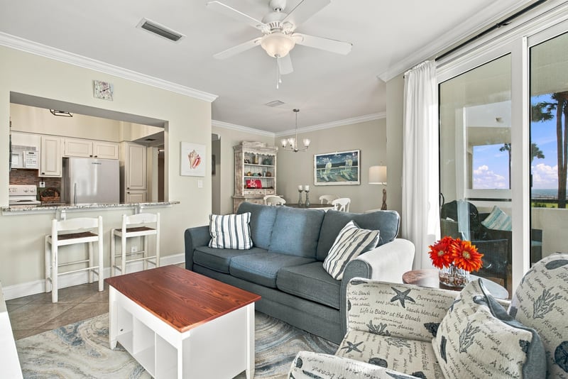Living room and kitchen pass-through with coffee table at 805 Spinnakers Reach Dr, Ponte Vedra Beach, FL 32082