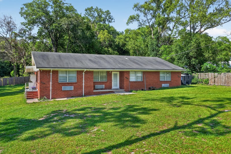 Front exterior view with driveway at 5745 110th St, Jacksonville, FL 32244