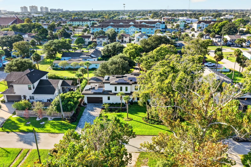 Aerial view of the neighborhood with water visible in the distance in Jacksonville Beach, FL