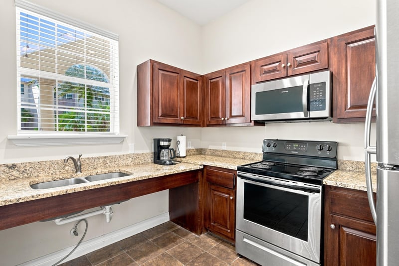 Clubhouse kitchen with granite counters in Reserve at Point Meadows