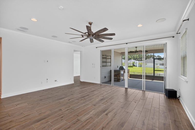Living room with sliding glass doors at 855 Flach Dr, St. Johns, FL